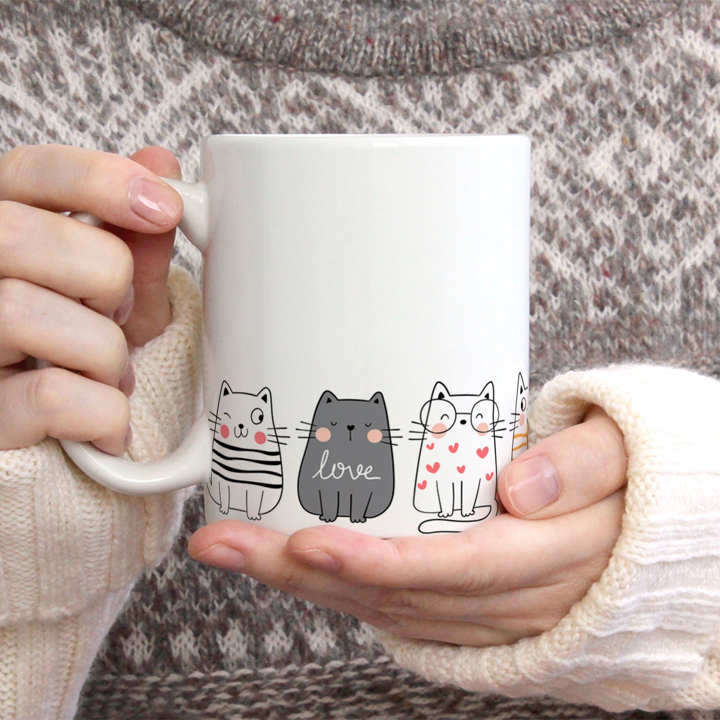 Cute cats stand on a mug