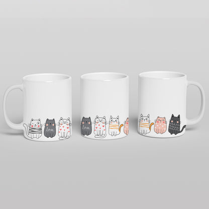 Cute cats stand on a mug