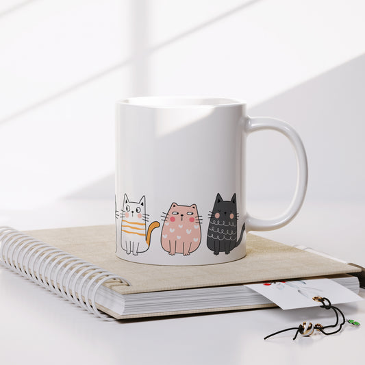 Cute cats stand on a mug